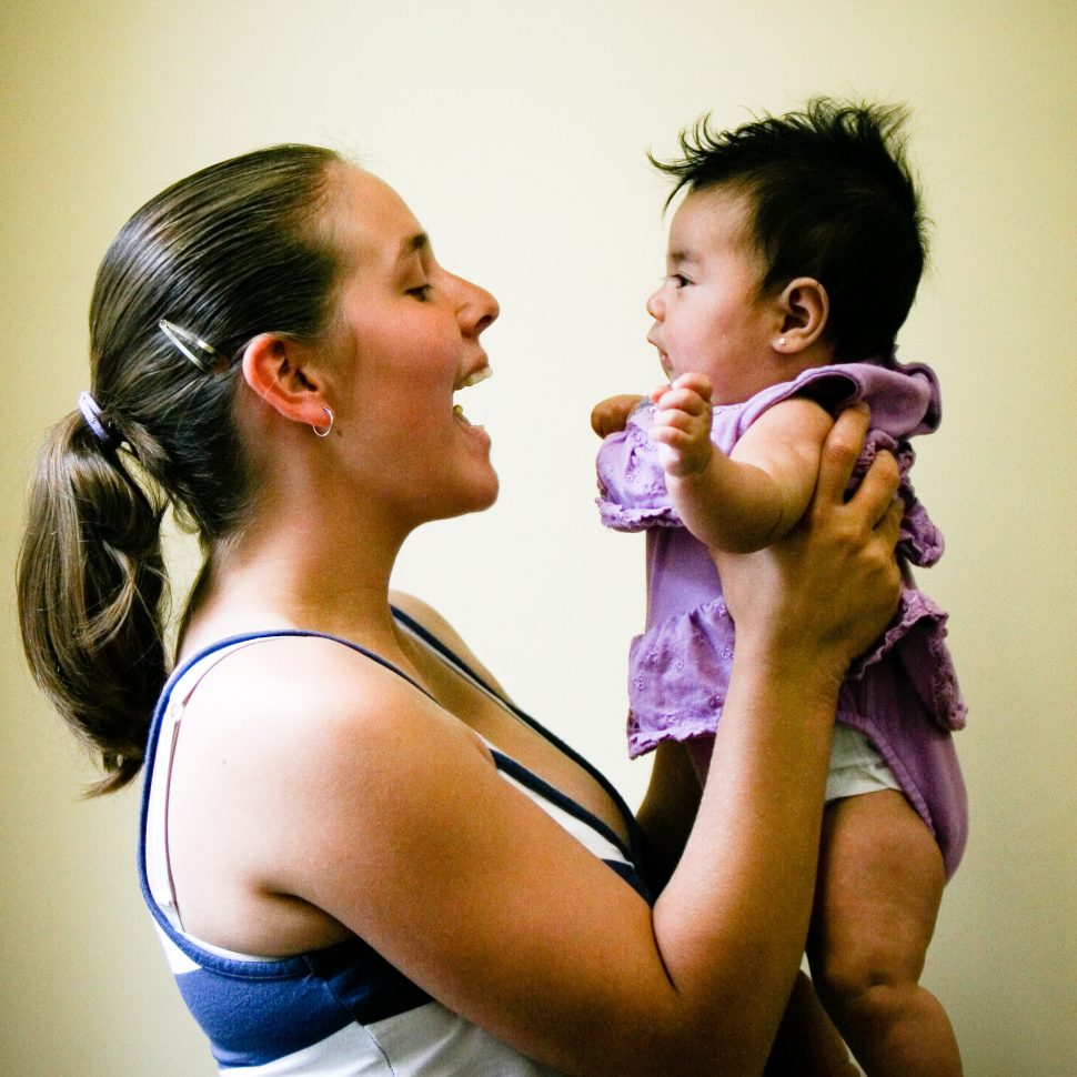 20070531-gracehaven-0275 copy a mother holding a kid smiling