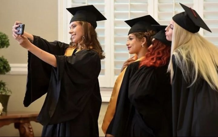 a graduate students taking selfie